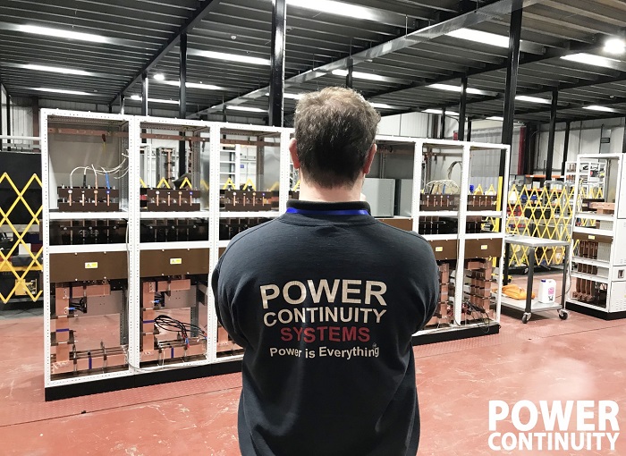 power continuity engineer with lv mains panel under construction.jpg