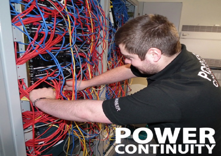 power continuity engineer working in a server room.jpg